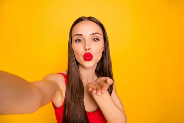 Photo of amazing model lady making selfies hold hand send air kiss blog followers wear red swimming suit isolated yellow background — Stock Photo, Image