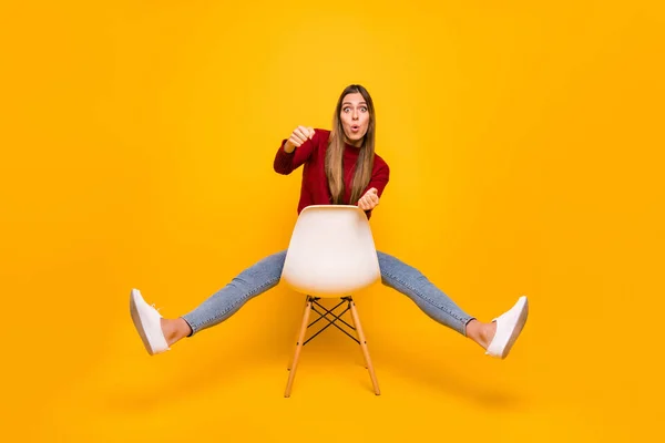 Full body photo of lady sitting chair pretend racing car driver wear pullover isolated yellow background — Stock Photo, Image