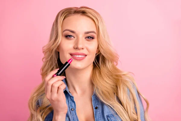 Closeup photo of pretty lady apply new pomade on lips wear denim outfit isolated pink background — Stock Photo, Image
