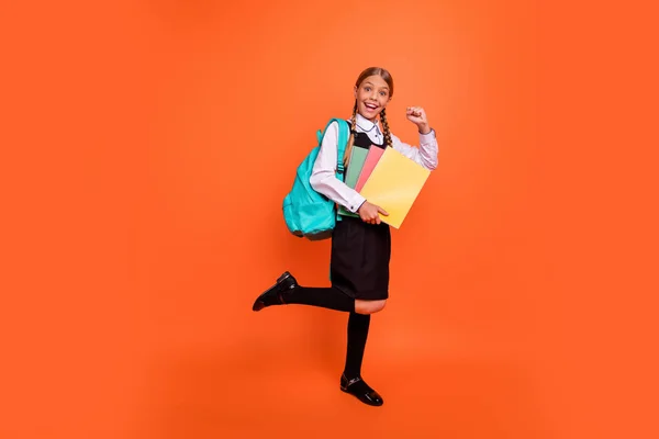Full length body size view of her she nice attractive lovely charming cheerful cheery girlish confident pre-teen girl best course class learner isolated over bright vivid shine orange background