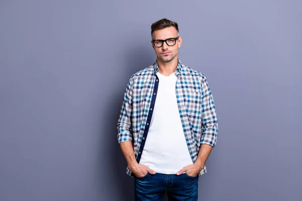 Close up photo intelligent he him his guy arms pockets reliable manager not smile self-confident self-assured person wear specs casual jeans denim plaid checkered shirt isolated grey background — Stock Photo, Image