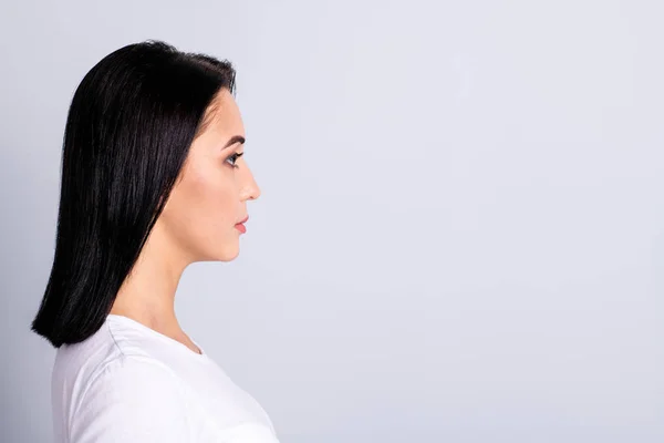 Close up side profile photo beautiful amazing she her lady perfect appearance look wondered empty space not smiling thoughtful ponder wear casual white t-shirt isolated bright grey background — стоковое фото