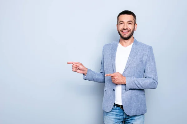 Close up photo amazing he he he he his guy macho cool great proposition hands arms indicating side empty space black friday sale discount wear formal-wear jacket blazer isolated grey background — Foto de Stock