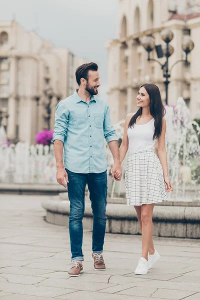 Fulll length body size view photo positive cheerful people millennial free time voyage weekend tourist visitor buildings fountain content rejoice fun denim jeans shirt blue dress sneakers bearded — Stock Photo, Image