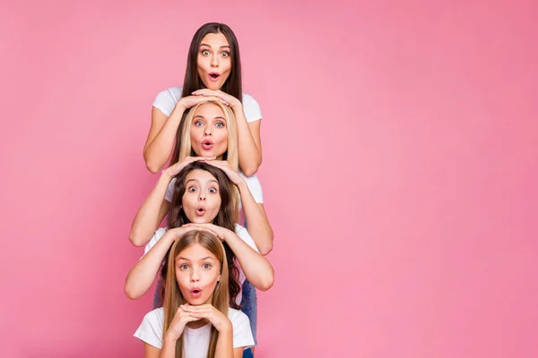 Nice attractive lovely glad cheerful cheery funny funky girlish long haired girls having fun building vertical duties spending holiday weekend isolated over pink pastel background — Stock Photo, Image