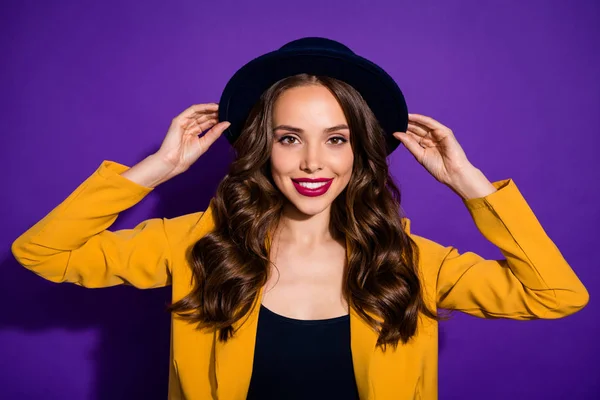 Close-up portrait of her she nice-looking attractive lovely winsome lovable fascinating cute well-dressed cheerful cheery wavy-haired lady touching hat isolated on bright vivid shine violet background — Stock Photo, Image
