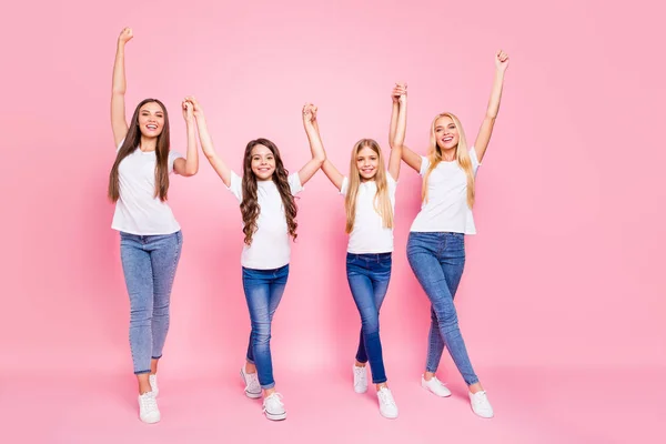 Two small and students ladies raising arms up ready for vacation wear casual outfit isolated pink background — Stock Photo, Image
