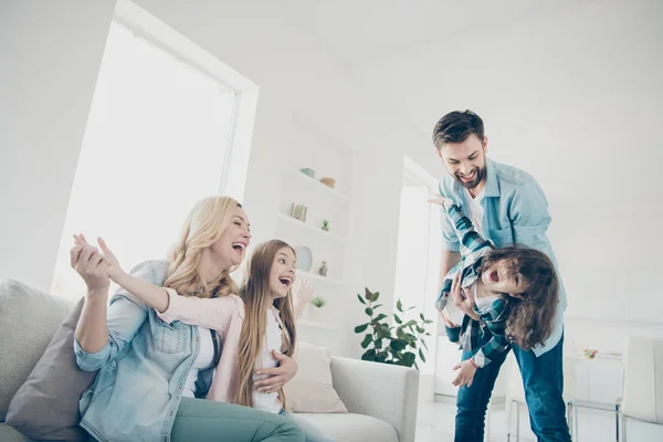 Photo of four people foster family moving like airplane with help parents hands cozy apartments indoors — Stock Photo, Image