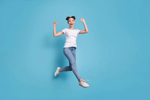 Full body photo of jumping lady came fihish race first wear white casual t-shirt jeans denim isolated blue background — Stock Photo, Image