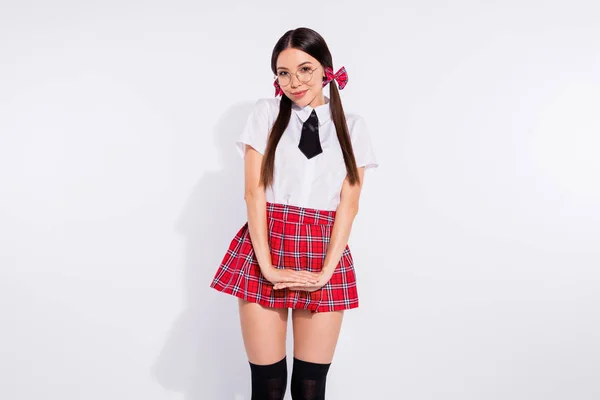 Portrait of her she nice-looking attractive winsome lovely charming cute cheerful modest girl wearing checkered skirt isolated over light white background — Stock Photo, Image