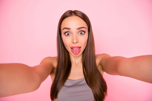 Close up photo of funky teenager making photo grimacing wearing singlet isolated over pink background — Stock Photo, Image