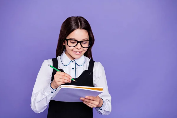 Close-up portrait of nice attractive lovely cheerful cheery diligent pre-teen girl nerd doing class home work task isolated over bright vivid shine violet background — Stock Photo, Image
