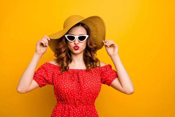 Coquette lady sending air kiss to handsome guy at pool party wear red dress specs hat isolated yellow background — Stock Photo, Image