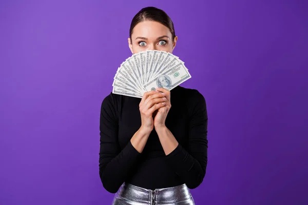 Portrait of impressed person hiding her mouth staring wearing black turtleneck silver skirt isolated over purple violet background — Stock Photo, Image