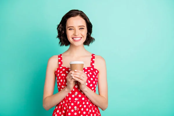 Foto de senhora bonita segurando quente fresco café desgaste vermelho pontilhado vestido isolado fundo teal — Fotografia de Stock