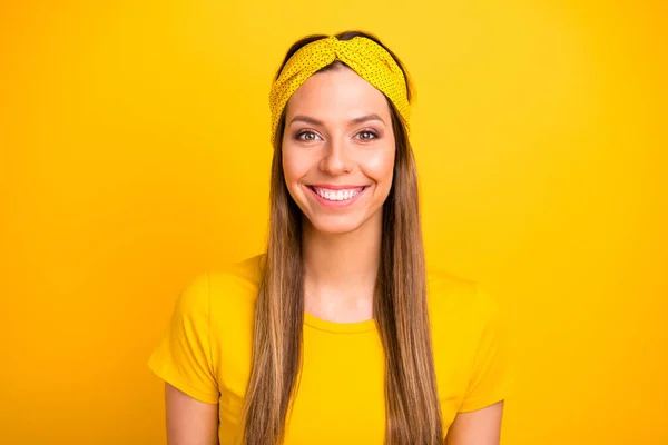 Portrait of attractive lady looking smiling isolated over yellow background — Stock Photo, Image