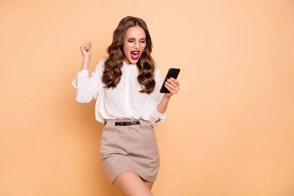 Portrait of her she nice-looking attractive lovely chic gorgeous glamorous cheerful wavy-haired lady browsing reading good news notification blog post like isolated over beige pastel background — Stock Photo, Image