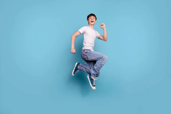 Full length body size photo of boy having made up his mind to run away from this planet while isolated with blue background — Stock Photo, Image