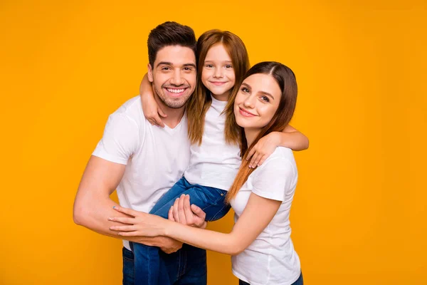 Portrait of three nice attractive charming cute sweet tender kind lovely cheerful cheery glad person embracing having fun day life dream isolated over bright vivid shine yellow background — Stock Photo, Image