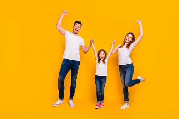 Full length body size view of three nice attractive charming lovely cheerful cheery crazy person having fun weekend great news rejoicing isolated over bright vivid shine yellow background — стоковое фото