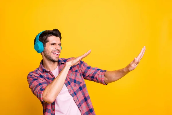 Photo of man chilling out unstoppable dancer whose energy never evaporates while isolated with yellow background — Stock Photo, Image