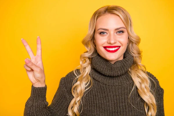 Photo of amazing lady showing v-sign symbol wear warm jumper isolated yellow background — Stock Photo, Image