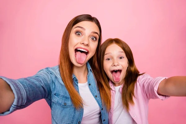 Close up photo of sweet people with foxy long hairstyle making faces wearing denim jeans shirts isolated over pink background — Stock Photo, Image