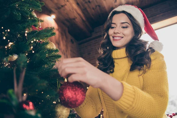 Low below angle view close up photo of charming girl decorating her tree while wearing yellow jumper knitted — Stock Photo, Image