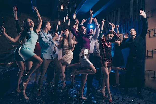 Full length body size view photo of funny funky youth youngsters raise hands band listeners loud noise indoors discotheque formalwear suit — стоковое фото