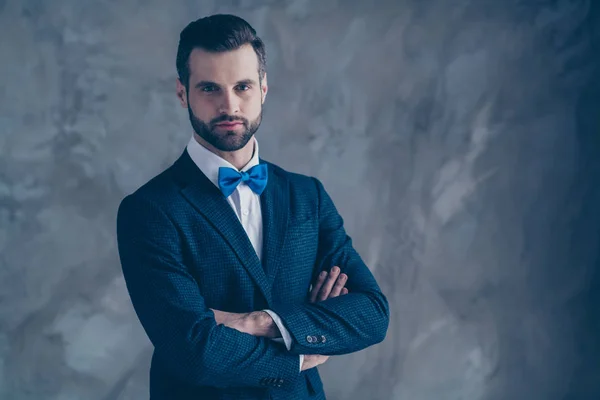 Turned photo of minded person with his crossed hands wearing bowtie blazer jacket isolated over gray background — Stock Photo, Image