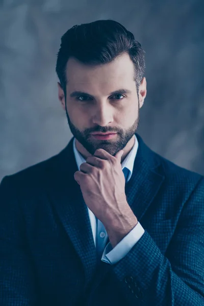 Portrait of elegant pensive man touching his chin looking wearing blazer jacket isolated over grey background — Stock Photo, Image