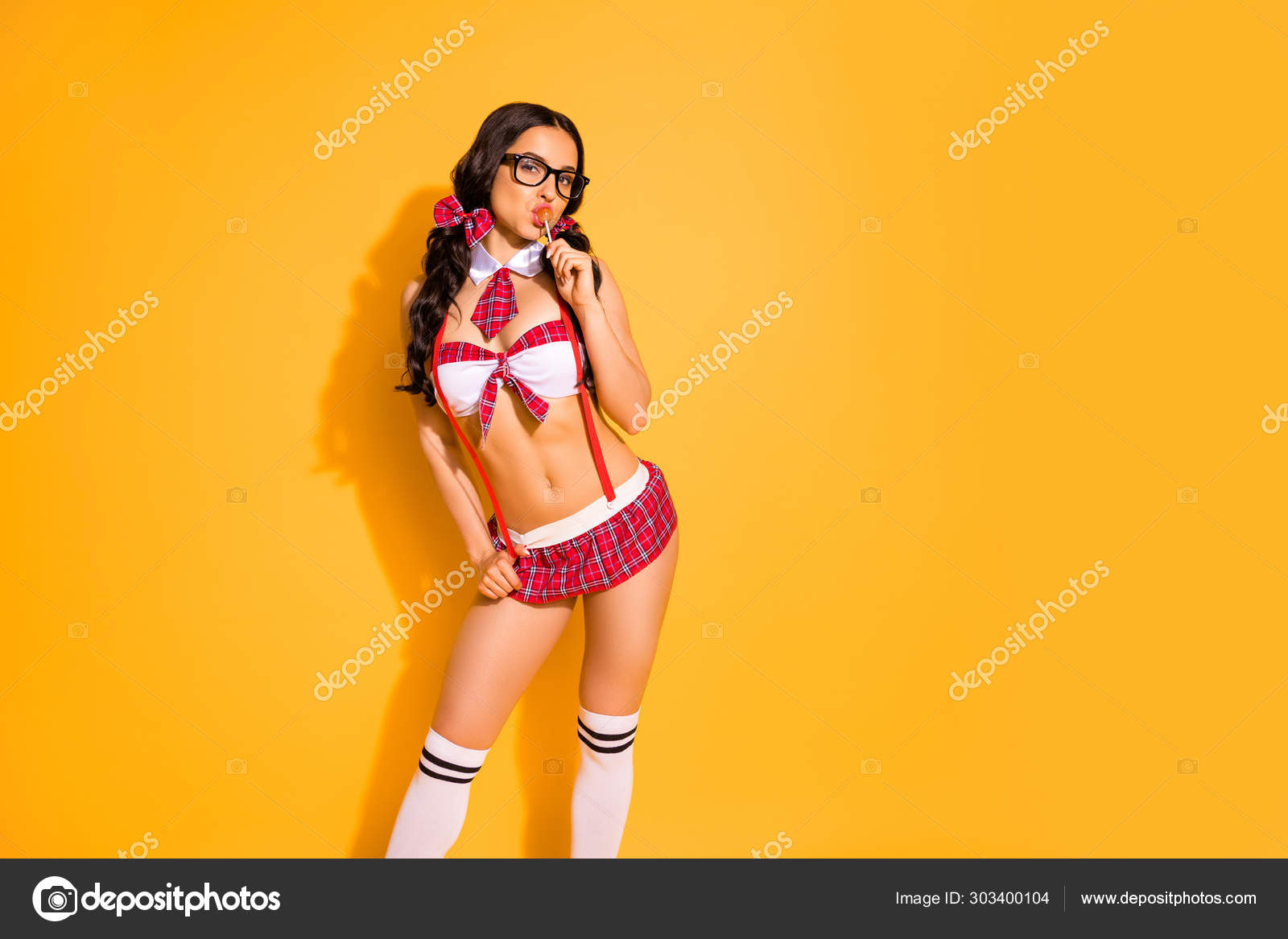 Photo of hot naked lady perfect shapes glam look hold lollipop mouth wear  red bra short skirt isolated yellow background Stock Photo by Â©deagreez1  303400104