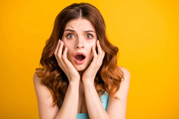 Close up photo of horrified frightened girlfriend feared with something being about to cry and shout wearing turquoise singlet while isolated with vibrant yellow color background — Stock Photo, Image