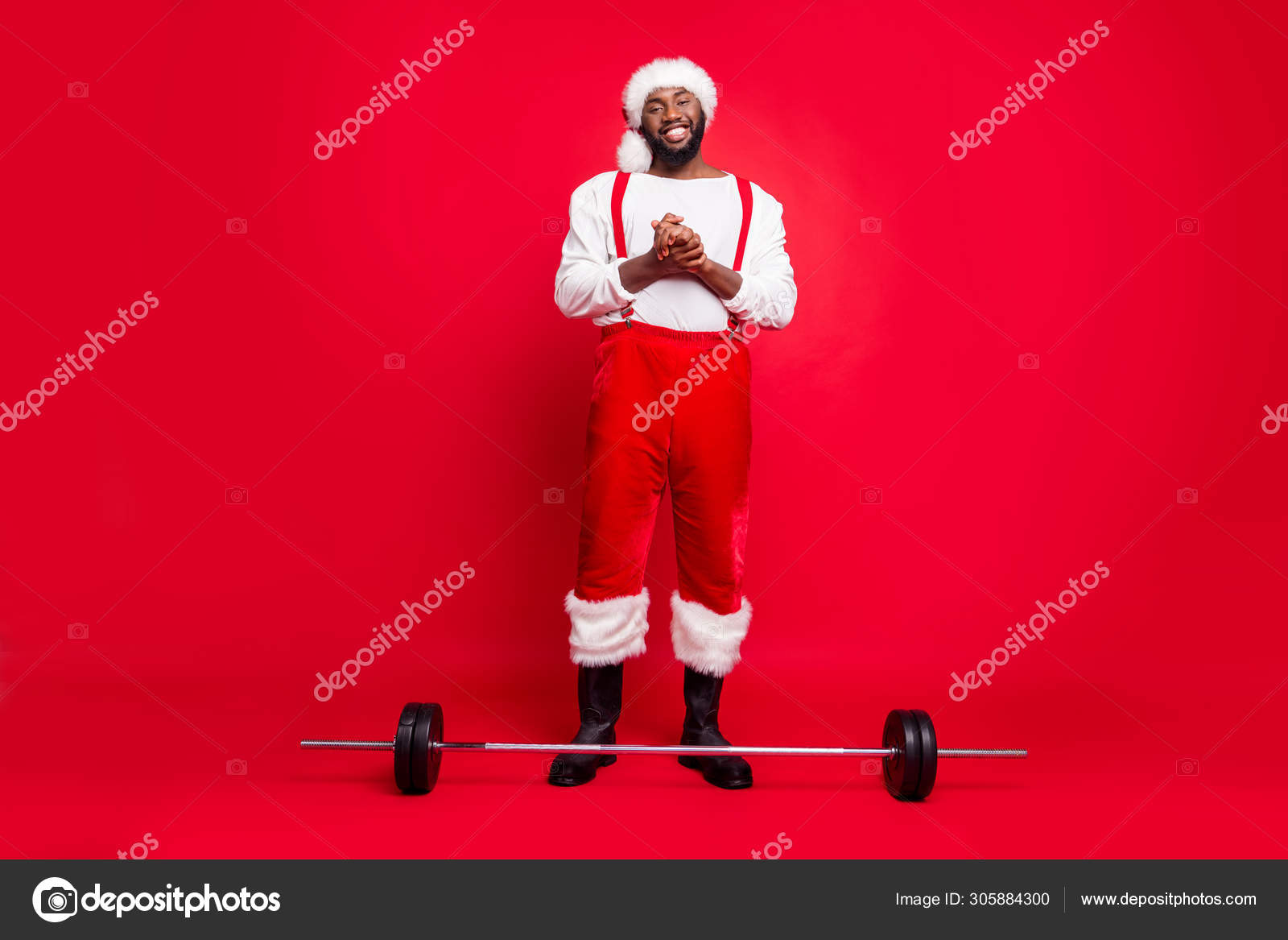 Full body photo of cheerful bearded sportsman black santa claus in