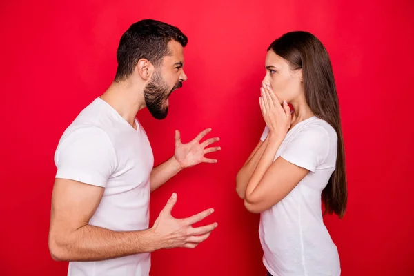 Photo of two arguing stylish trendy people with boyfriend shouting at his wife and girlfriend shocked about to cry while isolated with red background — Stock Photo, Image