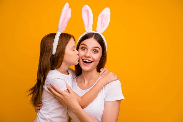 Close-up portrait of two nice attractive cheerful cheery excited sweet tender gentle adorable person mom mommy spending weekend having fun isolated over bright vivid shine yellow background — Stockfoto