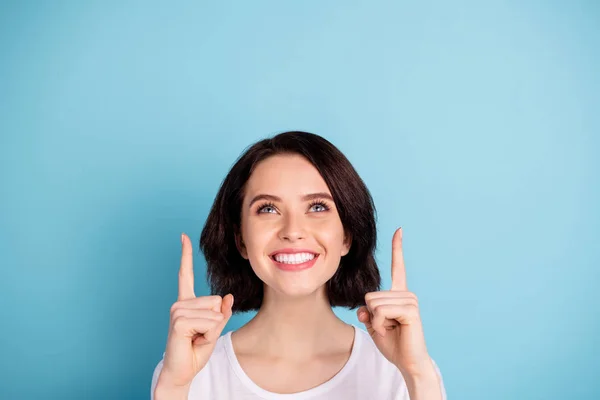 Close-up portrait of her she nice attractive lovely cheerful cheery glad confident girl pointing two forefingers up advert isolated on bright vivid shine vibrant blue turquoise color background — Stock Photo, Image