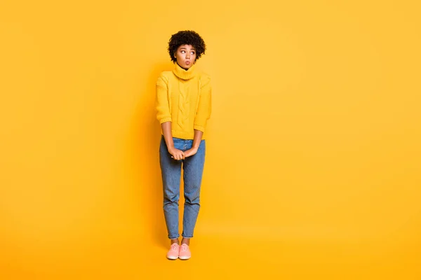 Full length body size photo of cute nice shy girlfriend hesitating to ask something wearing jeans denim yellow sweater isolated vivid color background — Stock Photo, Image