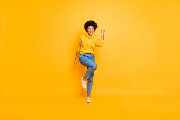 Full length body size view of her she nice attractive cute cheerful cheery ecstatic wavy-haired girl celebrating good news victory isolated on bright vivid shine vibrant yellow color background — Stock Photo, Image