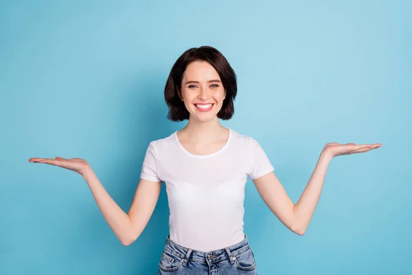 Portrait of her she nice attractive lovely confident cheerful cheery girl holding two invisible objects on palms isolated on bright vivid shine vibrant blue turquoise color background — Stock Photo, Image