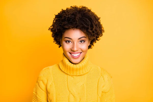 Photo of amazing dark skin lady with sweet very cute smile wear warm knitted jumper isolated yellow background