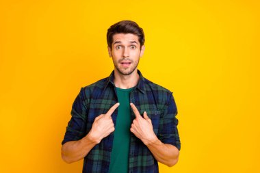 Photo of amazing guy indicating finger on his chest not believe everybody blaming him wear casual plaid shirt isolated yellow color background clipart