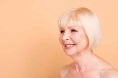 Close-up portrait of her she nice-looking attractive well-groomed confident cheerful gray-haired lady perfect smooth clear shine silky skin isolated over beige pastel background clipart