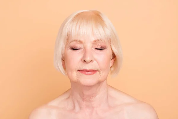 Close-up portrait of her she nice attractive lovely charming groomed peaceful gray-haired lady flawless sensitive skin instant positive effect facial oil balm cream mask isolated over beige background — Stock Photo, Image