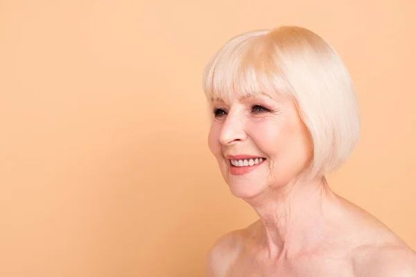 Close-up portrait of her she nice-looking attractive well-groomed confident cheerful gray-haired lady perfect smooth clear shine silky skin isolated over beige pastel background — Stock Photo, Image