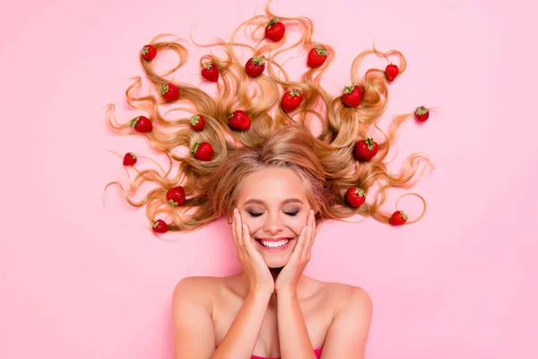 Close up top above high angle view photo beautiful very glad skin condition she her lady lying down among fruits strawberries long hair full vitamins complex eyes closed isolated pink background — Stock Photo, Image