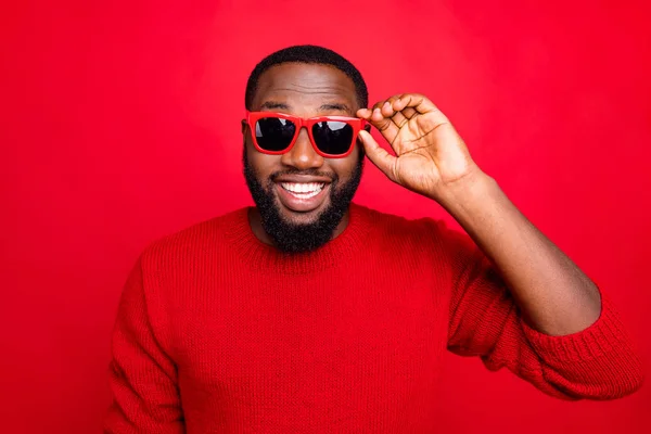 Close-up portrait of his he nice attractive cheerful cheery content cool bearded guy touching specs isolated over bright vivid shine red background — Stock Photo, Image