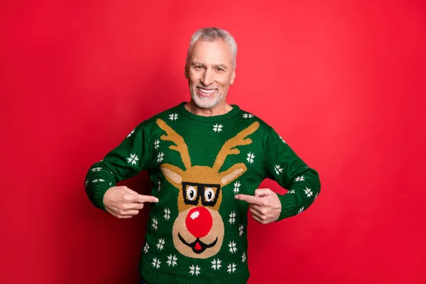 I wear the best decorated jumper concept. Photo of satisfied positive nice handsome glad cool granddad demonstrating his new traditional clothes with antler picture isolated bright color background — Stock Photo, Image