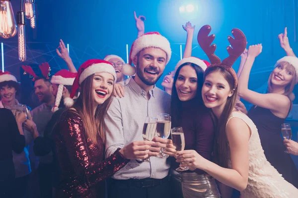 Corporate party concept.Nice attractive stylish cheerful cheery positive ladies and guys having fun chill out rest relax tradition winter season vacation December at modern luxury fogged nightclub