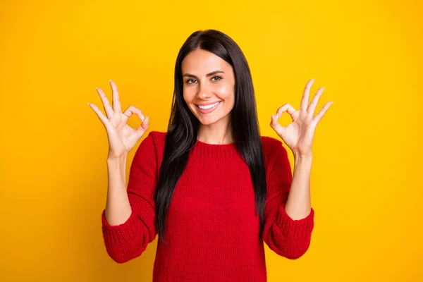 Portrait of charming lady show ok sign advertise promo wear red jumper isolated over yellow background — Zdjęcie stockowe